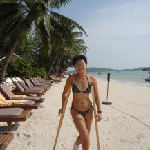 on crutch while beach holidaying